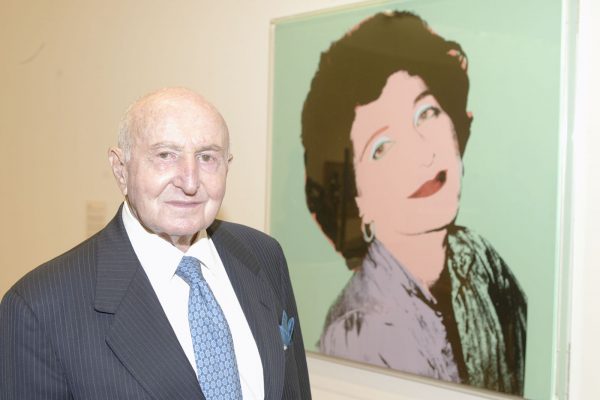 Raymond D. Nasher poses in front of Andy Warhol's portrait of his late wife, Patsy. Photo by Duke Photography.