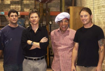 Satch Hoyt (in the hat) poses under the completed Celestial Vessel with Chief Curator Trevor Schoonmaker (second from left) and members of the fabrication team. Photo by J Caldwell.