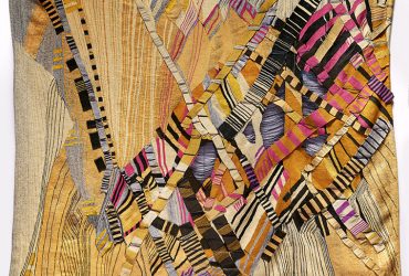 This large textile work by Silvia Heyden conveys the frenzy and chaos of a storm by combining converging, intricate patterns with dynamic, multi-colored strips of textiles layered in three dimensions.