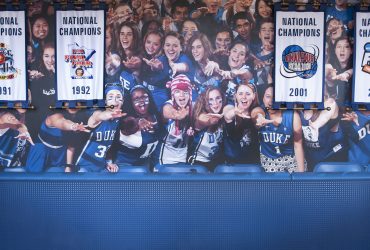 Duke students, a.k.a. “Cameron Crazies,” yell from a mural at the Duke Basketball Museum, within Cameron Indoor Stadium. Photo by J Caldwell.