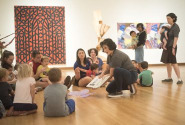 Visitors bring children ages 1 to 5 years for a story read in English and Spanish at the Nasher Museum.