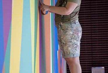 The making of Odili Donald Odita's wall painting, "Shadow and Light (For Julian Francis Abele)," 2015. Photo by J Caldwell.