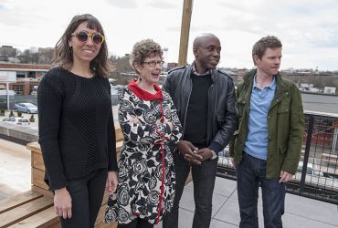 (From left) Reneé M. Cagnina Haynes (Exhibitions and Publications Manager) surveys Durham from the rooftop of the Pit restaurant with Nasher Museum Director Sarah Schroth, artist Odili Donald Odita and Chief Curator Trevor Schoonmaker.