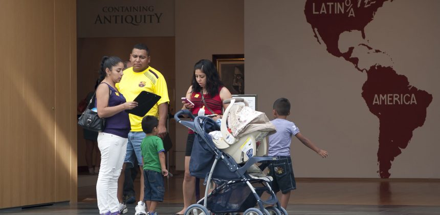 A family prepares to enter the pavilion with a gallery hunt activity. Photo by J Caldwell.
