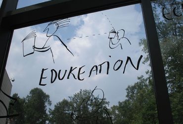 Dan Perjovschi creates humorous drawings on the museum’s exterior windows using current events and situations special to Duke as his inspiration. Photo by Duke Photography.