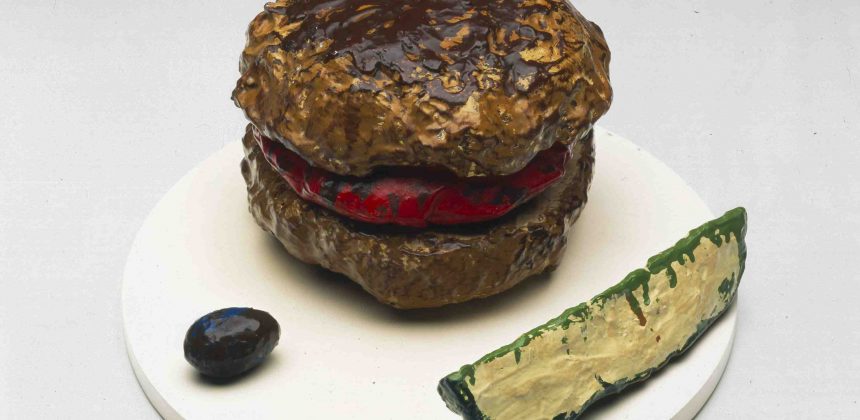 Claes Oldenburg, Hamburger with Pickle and Ochre, 1960. Muslin soaked in plaster over wire frame, painted with enamel, 7 x 9 x 9 inches. Image courtesy of the Museum of Contemporary Art, Los Angeles. The Panza Collection.