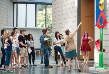 Graduate student assistant Shannan Hayes leads a tour of Miró: The Experience of Seeing, starting with Miró’s painted bronze sculpture from 1967, Caress of a Bird (La Caresse d’un oiseau), on loan from the Raymond and Patsy Nasher Collection, Nasher Sculpture Center, Dallas. Photo by J Caldwell.