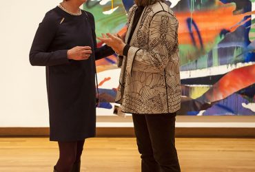 Art conservator Ruth Cox (left) chats with Nasher Gallery Guide Ruth Caccavalle within the exhibition A Material Legacy. Photo by J Caldwell.