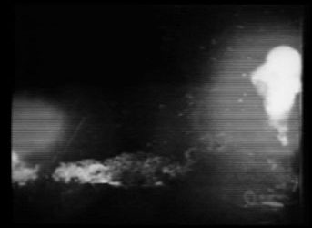 A still from the video shows murky explosions.