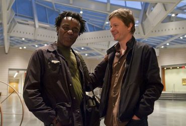 Celebrated British filmmaker John Akomfrah chats with Chief Curator Trevor Schoonmaker before the screening of his film and accompanying talk. Photo by J Caldwell.