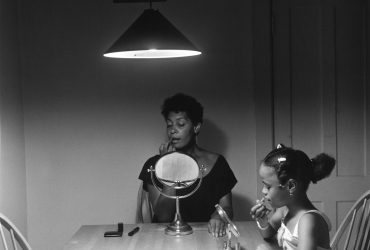 Carrie Mae Weems, Untitled (Woman and daughter with makeup) from Untitled (Kitchen Table Series), 1990. Silver print, 27 ¼ x 27 ¼ in. Courtesy the artist and Jack Shainman Gallery, New York.