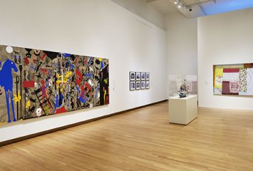 Gallery installation view, featuring (at left), Deborah Grant's work, In the Land of the Blind the Blue Eye Man is King from the series By the Skin of Our Teeth.