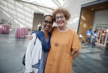Artist Sonya Clark shares a moment with Susan Hendricks, wife of artist Barkley L. Hendricks, at the exhibition opening. Photo by J Caldwell.