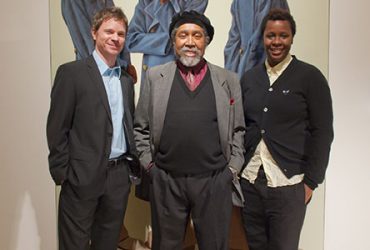 Chief Curator Trevor Schoonmaker with artists Mickalene Thomas and Barkley L. Hendricks in front of a painting by Barkley. Photo by J Caldwell.