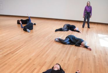 Participants of Parliament stand, walk, lie down and otherwise navigate an empty gallery space, in silence, for six hours a day, over the course of four days, at the Nasher Museum. Photo by J Caldwell.