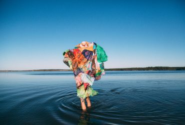 Maya Freelon, Trust from the series Wade in the Water, 2016 (printed 2018). Archival pigment print, 28 x 42 inches (71.12 x 106.68 cm). "Performance with Tissue Quilt," directed by Maya Freelon and documented by Chris Charles.