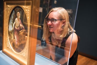 A visitor looks at a work for art by Carlo Dolci during the opening of "The Medici's Painter."