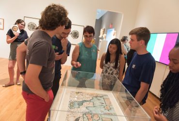 Duke Students enjoy a tour of the installation In Transit: Arts & Migration Around Europe