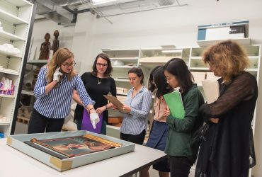 Susanna Caviglia, assistant professor of Art, Art History, & Visual Studies, brings graduate students in her course, 18th-Century Art and Architecture, to examine the scroll with Julia K. McHugh, Ph.D. (far left), Trent A. Carmichael Curator of Academic Initiatives at the Nasher Museum. Photo by J Caldwell.