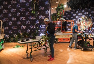 Ebony G. Patterson and the preparators work on changing the gallery into a night garden