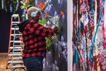Artist Ebony G. Patterson creates a night garden at the exhibition entrance wall