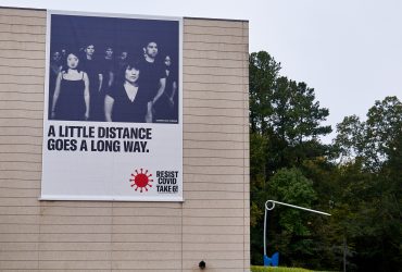 A RESIST COVID / TAKE 6! banner at the Nasher Museum. Courtesy of Carrie Mae Weems. Photo by Robert Zimmerman.