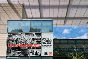 A RESIST COVID / TAKE 6! window cling at the Rubenstein Arts Center, facing Campus Drive. Courtesy of Carrie Mae Weems. Photo by J Caldwell.