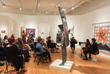 Members of Duke University's Music Department perform for a group of Reflections visitors in the exhibition Cosmic Rhythm Vibrations.