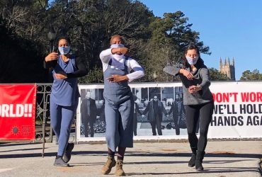 Dancers Alyah Baker, Amanda Edwards and Courtney Liu at the entrance to Sarah P. Duke Gardens responding to RESIST COVID / TAKE 6! by artist Carrie Mae Weems