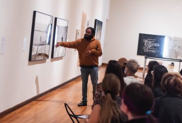 Artist Cornell Watson gives a talk about his work in Reckoning and Resilience: North Carolina Art Now. Photo by J Caldwell.