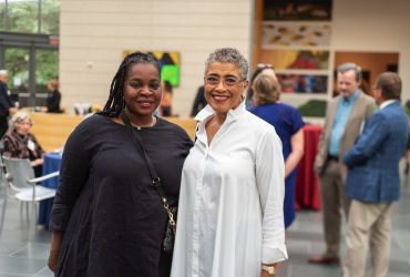 Longtime museum supporter and gallery guide Gail Belvett and a friend