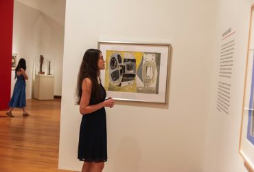 A visitor explores "Roy Lichtenstein: History in the Making, 1948 — 1960