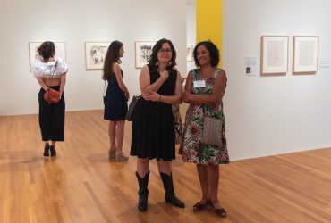 Visitors explore "Roy Lichtenstein: History in the Making, 1948 — 1960"