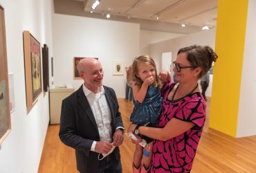 Curator Marshall N. Price with his partner Martha Clippinger and their daughter in the "Roy Lichtenstein" exhibition.