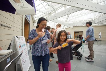A family enjoys Locopops in the Great Hall during the third annual Nasher Community Celebration