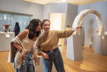 A pair of Duke students admire a work of art in the museum's collections gallery