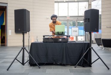 Aaron Pankey spins for the crowd at the Director's Preview