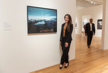 Artist Acacia Johnson with her work in the exhibition Second Nature