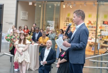 Director Trevor Schoonmaker delivers remarks during the preview of the latest exhibition Second Nature